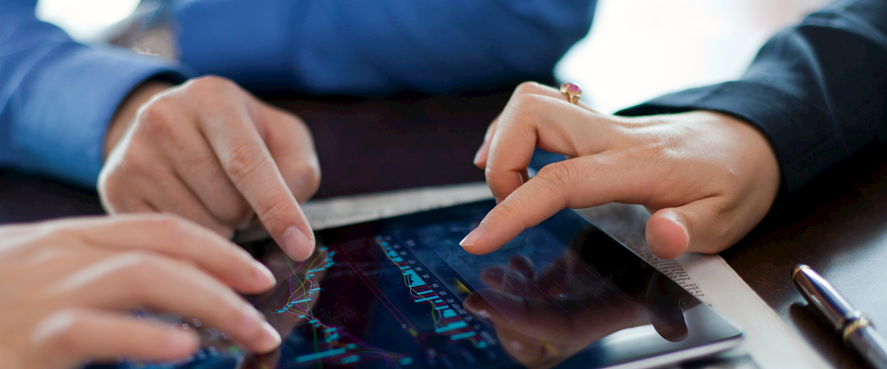 Hands on a tablet
